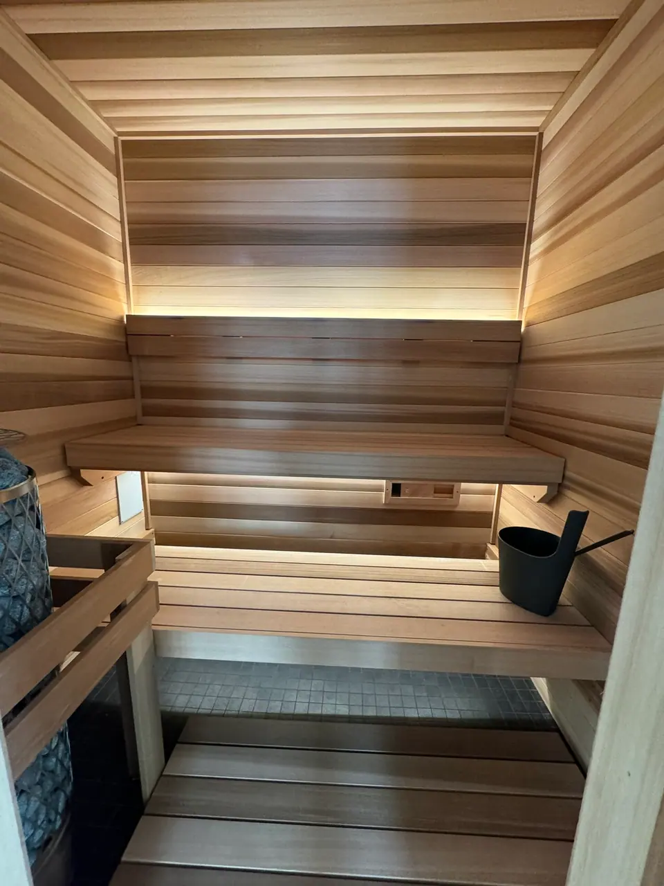 Indoor sauna benches with a bucket and ladle