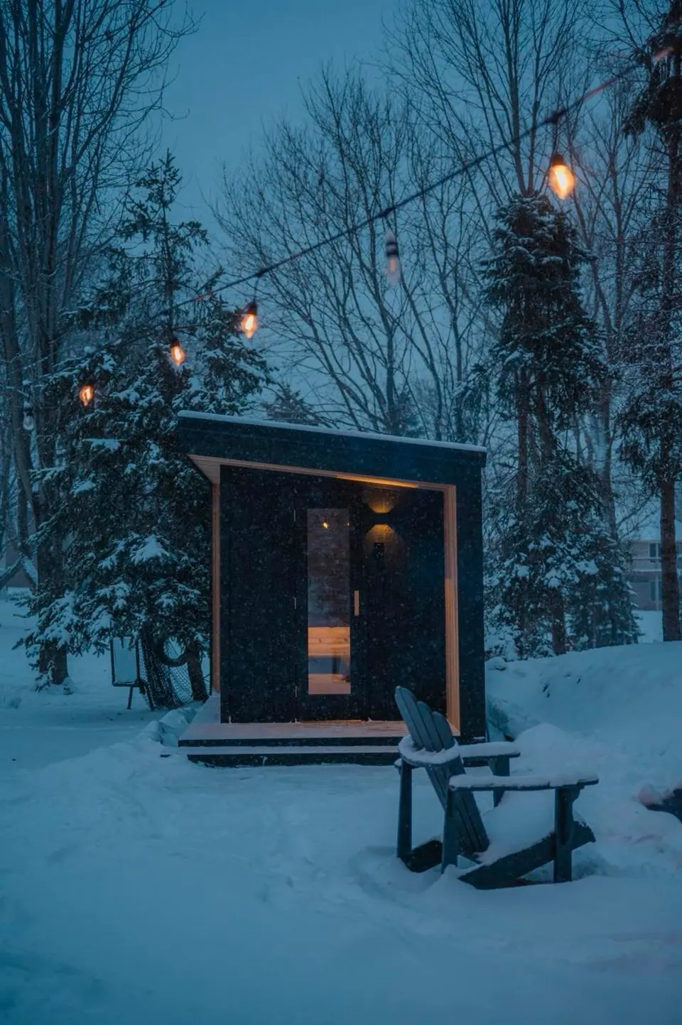 The Northern Steam Tuli sauna at Nordic Escape on a snowy evening