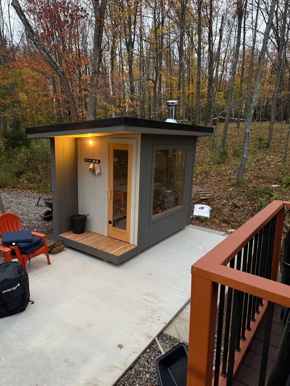 Sauna with a covered porch on a patio in fall